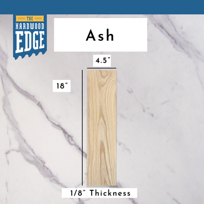 .125"x4.5"x18" Ash hardwood on a marble background, branded 'The Hardwood Edge'.